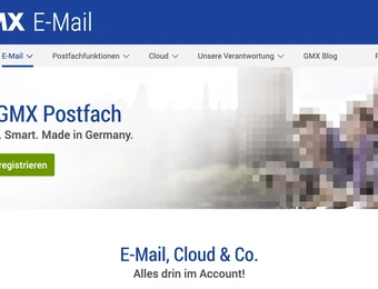 GMX E-Mail-Seite mit blauer Kopfzeile und Logo links; Text 'Ihr GMX Postfach', grüner Button 'Jetzt registrieren'.