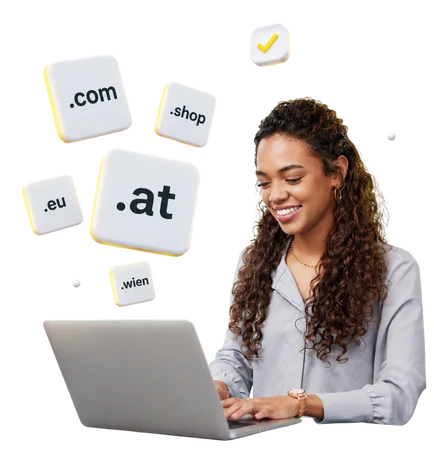 Eine Frau sitzt am Laptop; schwebende Würfel zeigen Domain-Endungen wie .com .shop .at .eu .wien.